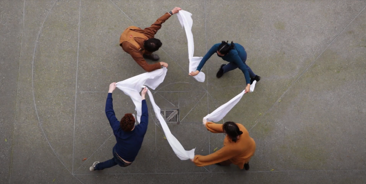 four dancers shot from above